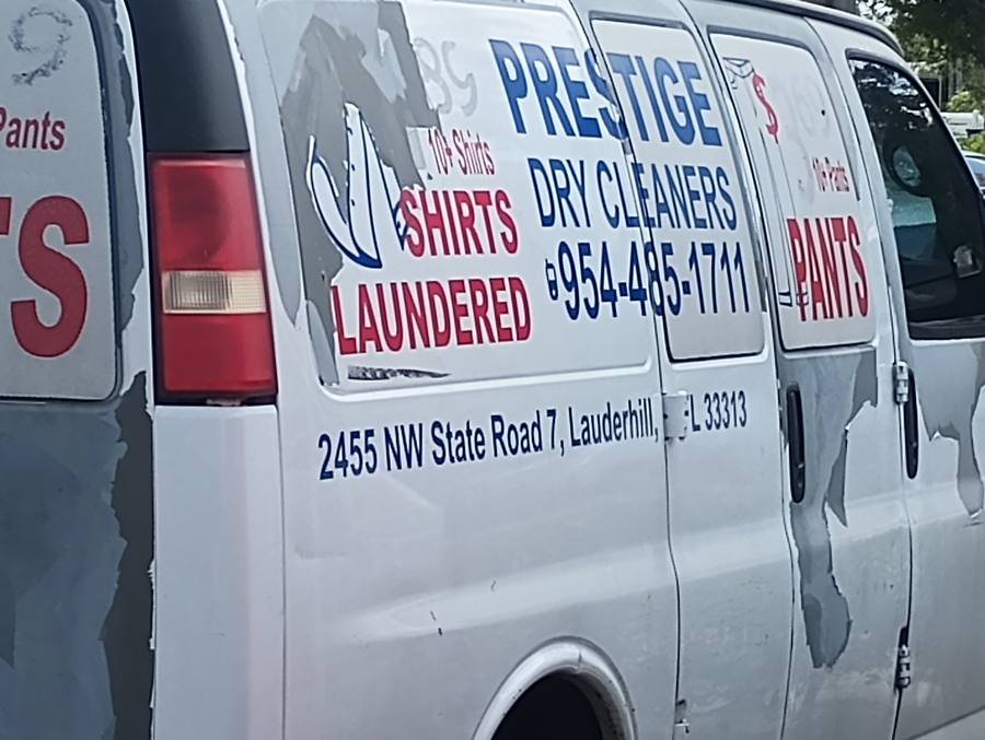 Prestige Dry Cleaners peeling van wrap spotted on University Drive Sunrise FL